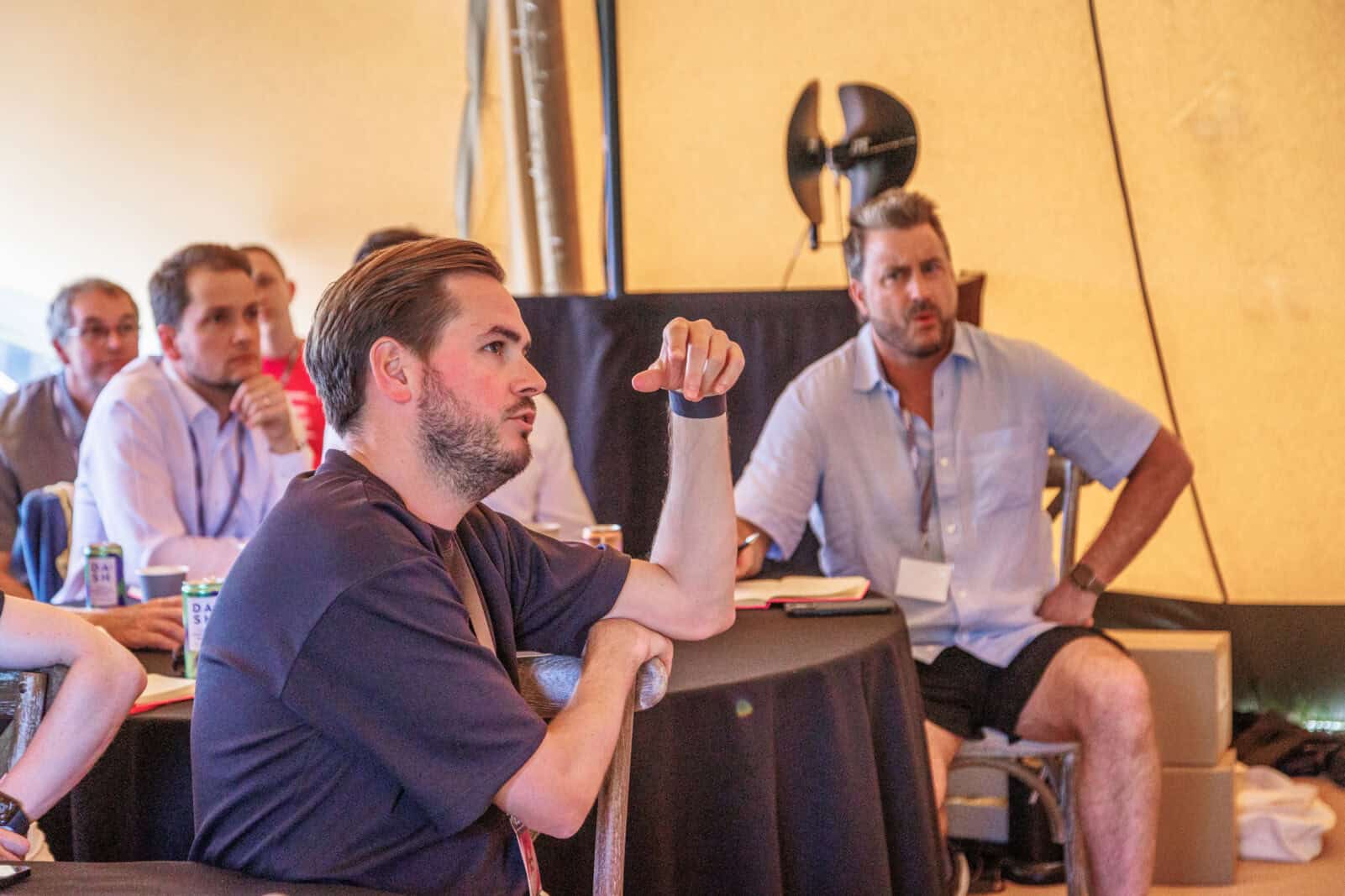 An entrepreneur and founder CEO engaging with an expert panel at an entrepreneur coaching event