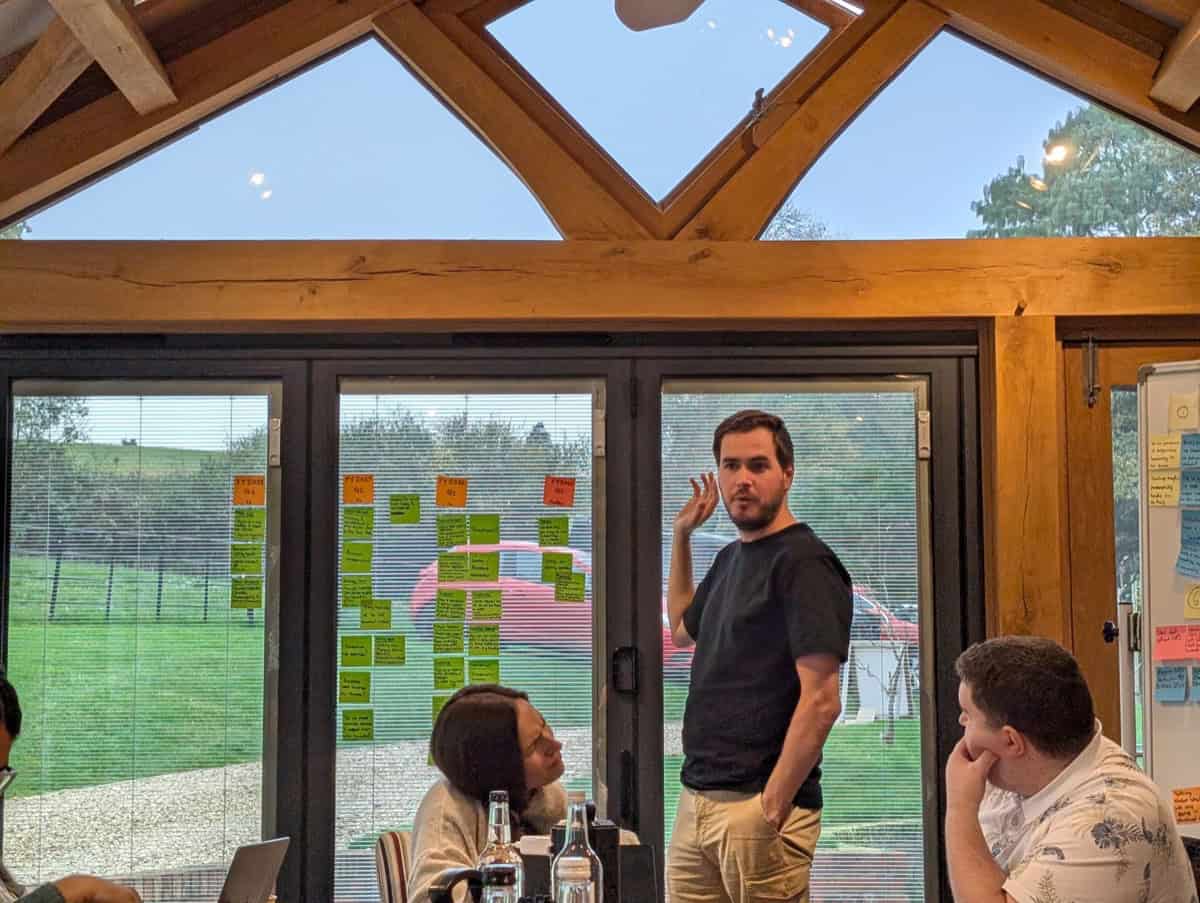 A facilitator leading a workshop discussion on building trust and honesty in business
