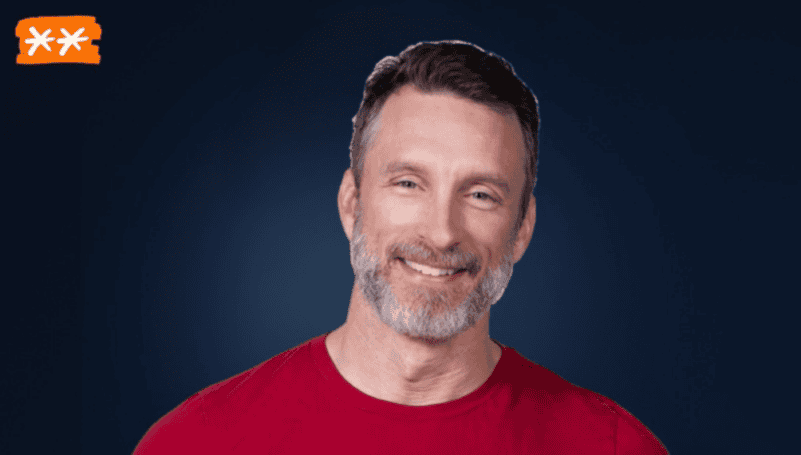 Man smiling, promoting Profit First method for business profitability.