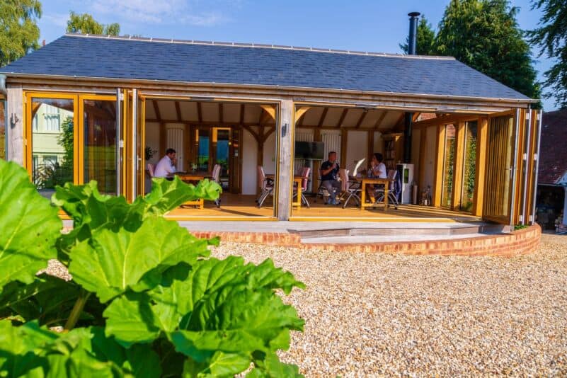 Small team working in a garden office, doing more with less