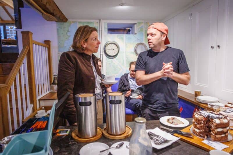 Chef and guest discussing food at Monkhouse & Company event.